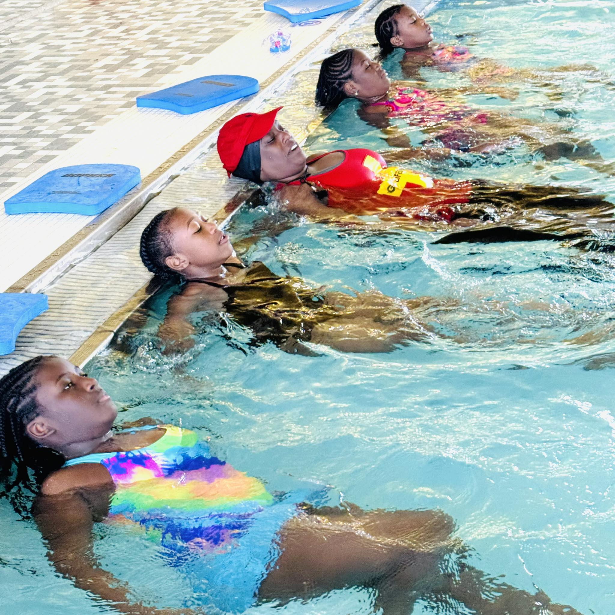 Five girls in a pool.